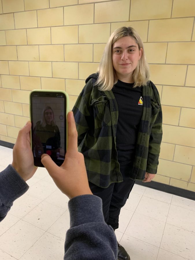 Sophomore Sarah Seligman steps in frame for a TikTok video.