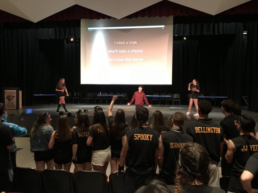 Seniors Carley Wells (far left), Joe Mioli (center) and Kamila Azbel (right) during the karaoke competition