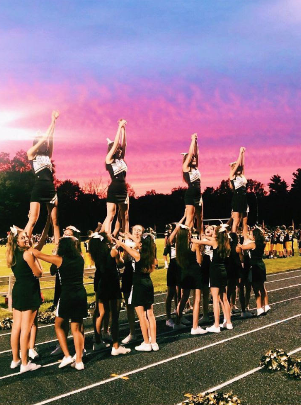 The team chants "Yell Cresskill", a crowd favorite, at Friday's home game. Flyers from left: Ashley Kim, Einav Meir, Nicole Moallen, Polina Alexa. 