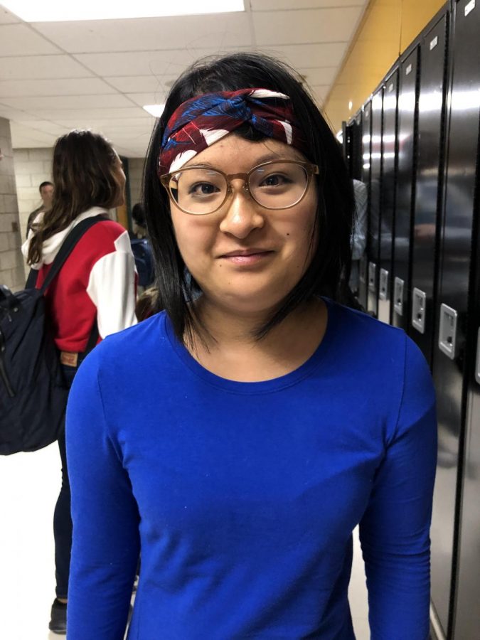 Senior Asaka Park models an American flag headpiece.