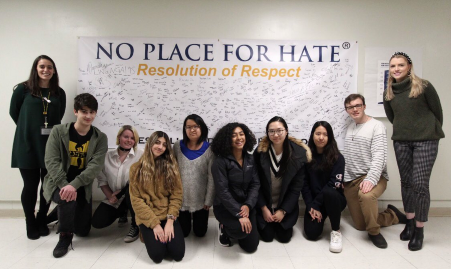 Mrs. McCarthy, Ms. Lynch, and student members of the No Place for Hate Committee pose with Cresskill’s Resolution of Respect Pledge.