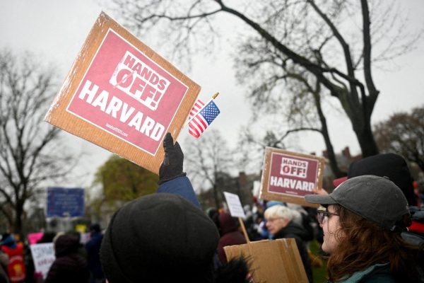 Demonstrators rally on Cambridge Common in a protest organized by the City of Cambridge calling on Harvard leadership to resist federal government interference at the university in Cambridge, Massachusetts, U.S. April 12, 2025. REUTERS/Nicholas Pfosi