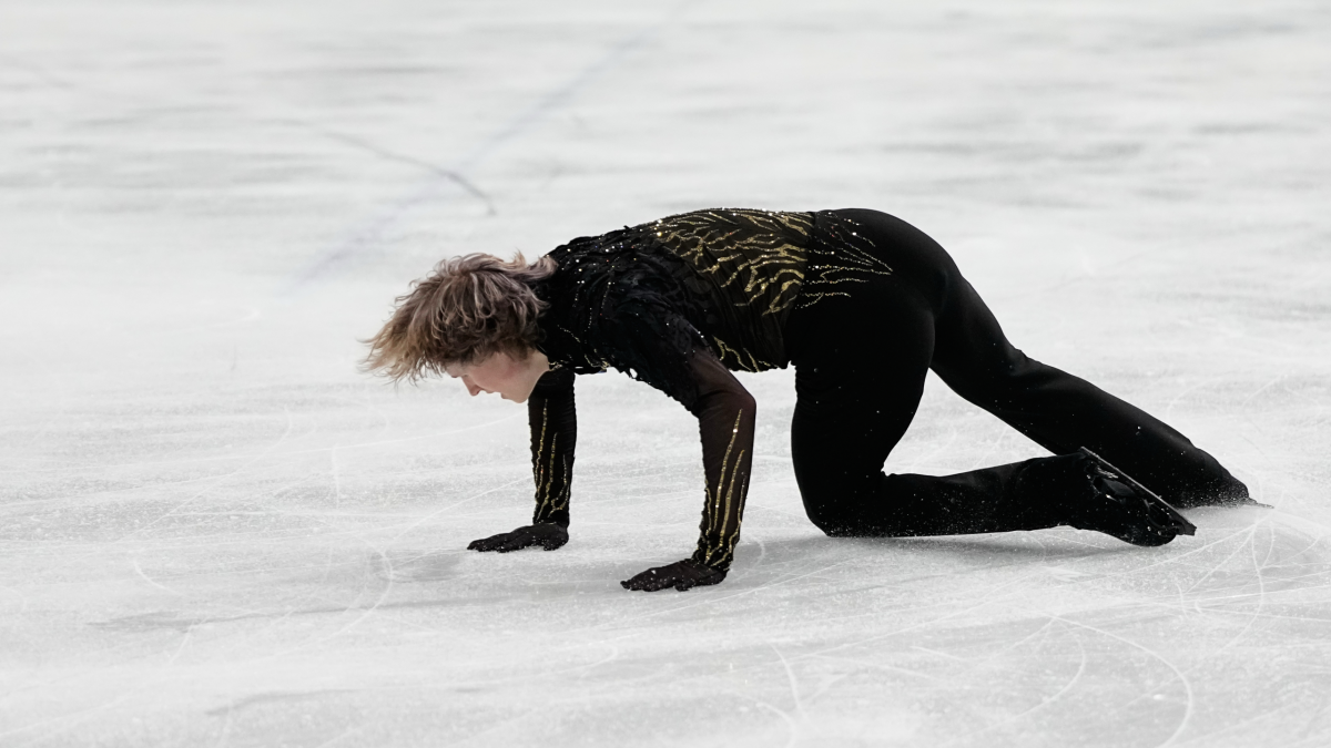 Ilia Malinin of the United States falls during the men’s free skate program in figure skating at the 2026 Winter Olympics, in Milan, Italy, Friday, Feb. 13, 2026. (AP Photo/Natacha Pisarenko)